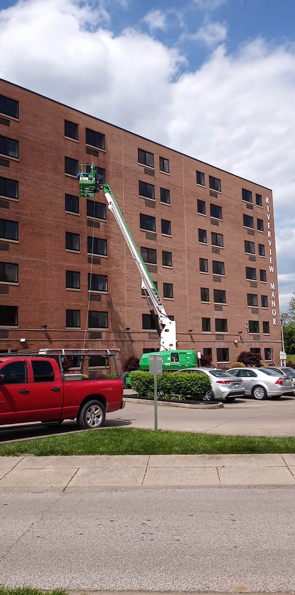 Lift raised against a multi storey brick building during a McGinnis wash